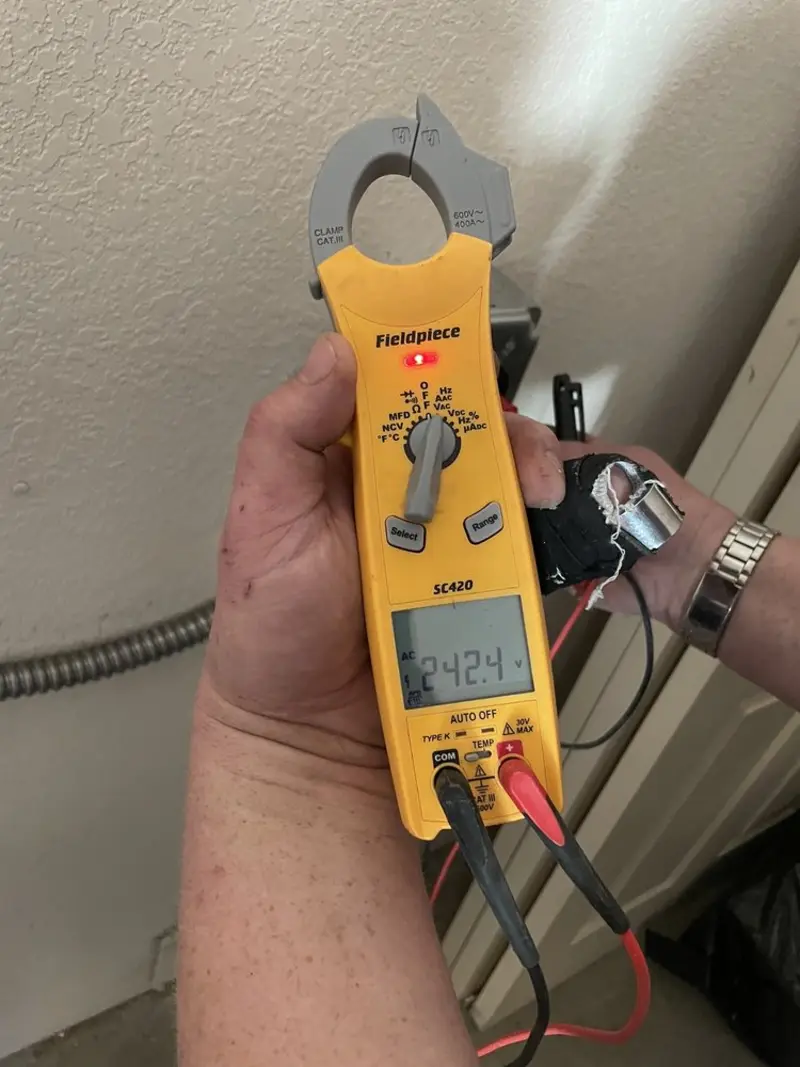 Voltage testing with clamp meter during Aluminum Wiring Replacement in Patterson